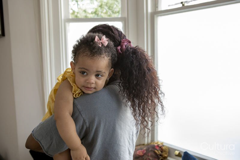 Mother with baby daughter at home