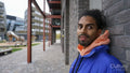 Portrait of young man wearing blue puffer jacket