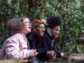 Mother with two daughters on footbridge