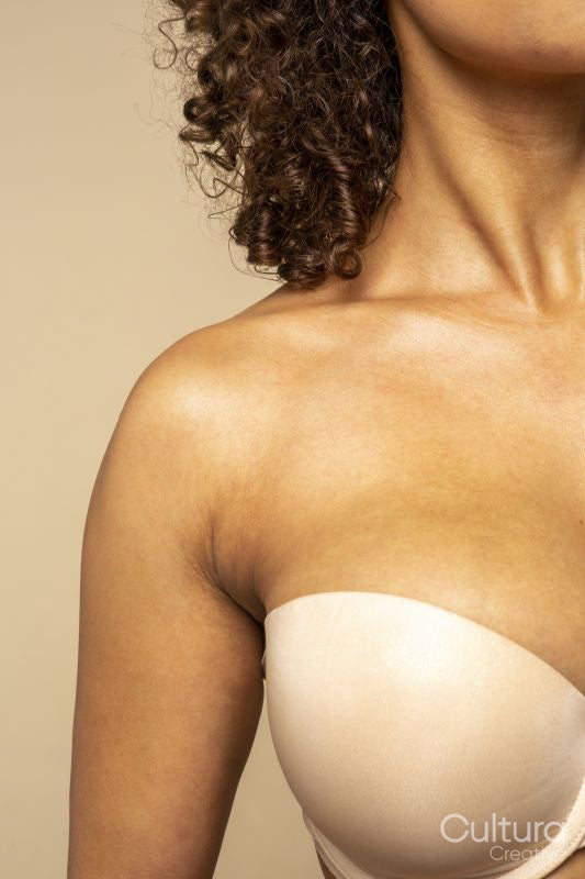 Close-up of woman in nude colored strapless bra