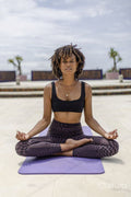 Woman meditating on terrace
