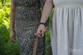 Midsection of couple holding hands