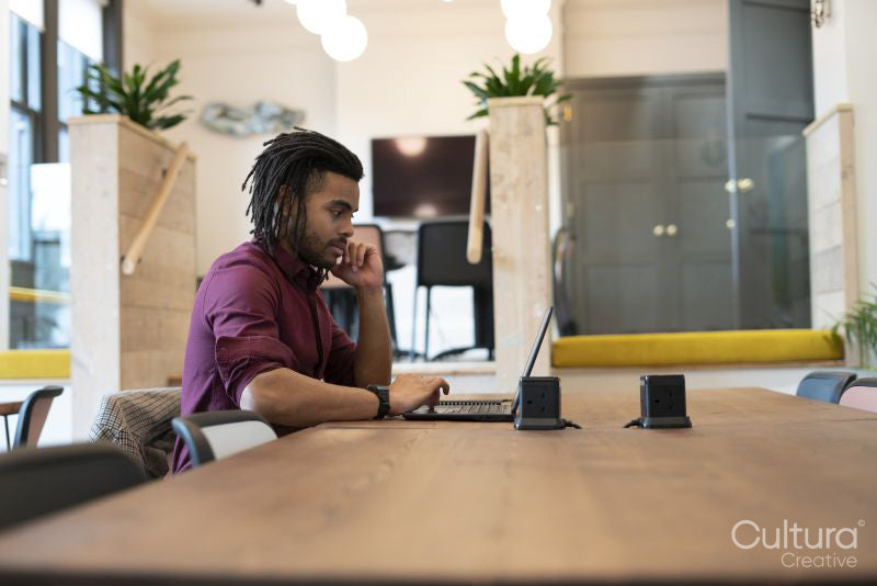 Businessman working on laptop in conference room