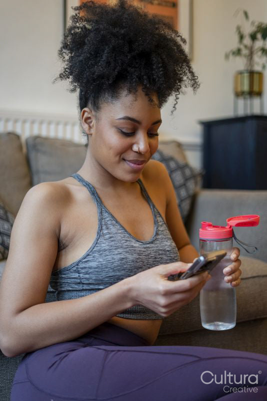 Young woman using phone at home