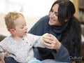 Mother and son holding toy rattle together