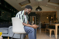 Man using mobile phone at home