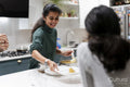 Woman serving food to daughter