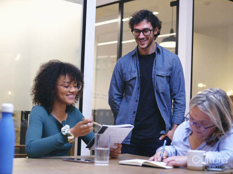 Coworkers having meeting in modern office