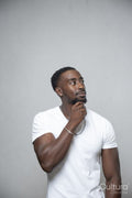 Man wearing white t-shirt and necklace