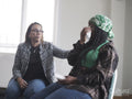Woman crying in group therapy session