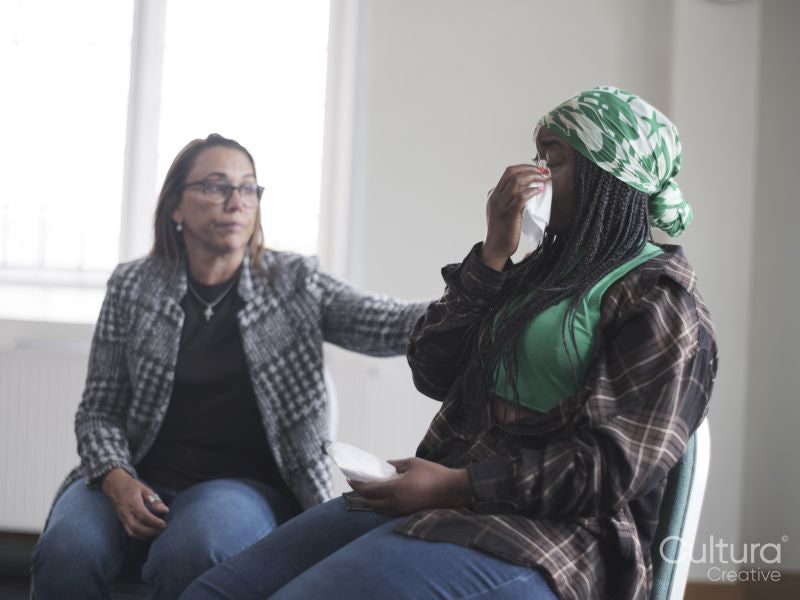 Woman crying in group therapy session