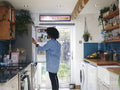 Woman opening fridge