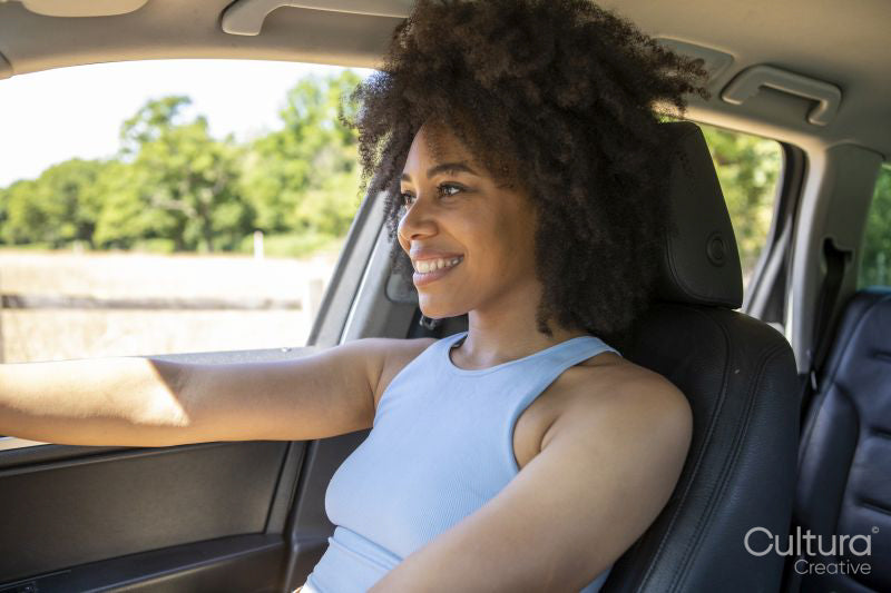 Young woman driving car