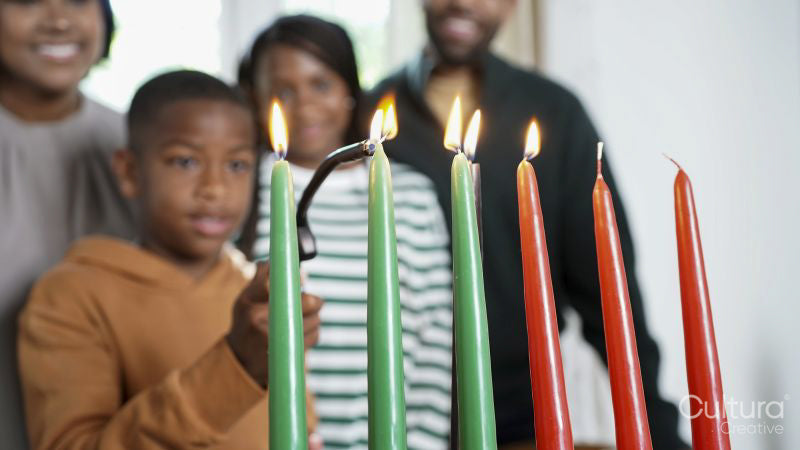 Family with children lighting kinara candles