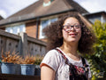 Portrait of girl standing in backyard