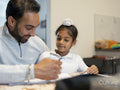 Father helping son with homework