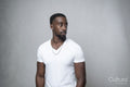 Portrait of man wearing white t-shirt and necklace