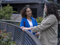 Smiling couple talking on bridge