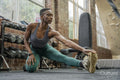 Athletic woman stretching at gym