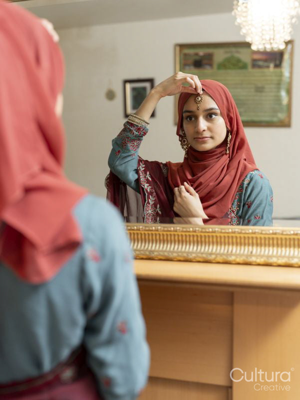 Woman preparing for Ramadan celebration at home