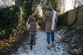 Mother and son having a walk on winter afternoon