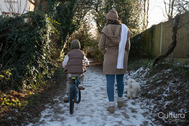 Mother and son having a walk on winter afternoon