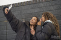 Two young women taking selfie
