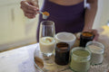 Woman preparing healthy drink at home