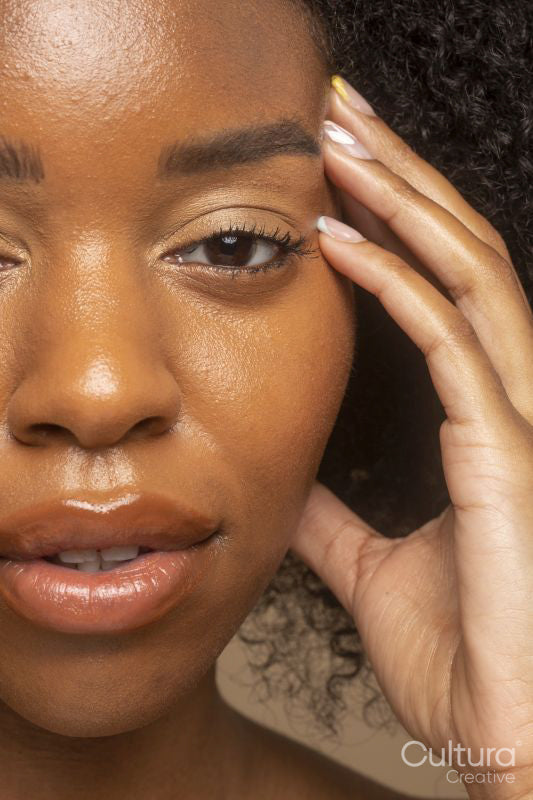 Close-up of woman touching face