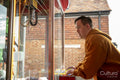 Man at toy grabbing game