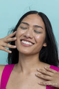 Smiling young woman with black long hair and closed eyes