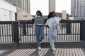 Young stylish women standing in city