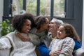 Smiling women with daughters at home