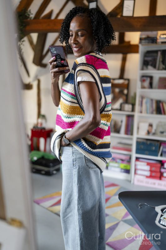 Smiling woman taking selfie at home