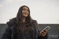 Young woman holding smartphone