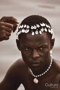 Man wearing traditional African jewelry