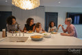 Family enjoying dinner in kitchen