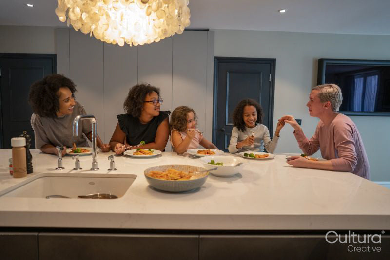 Family enjoying dinner in kitchen