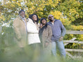 Portrait of two senior couples standing in nature