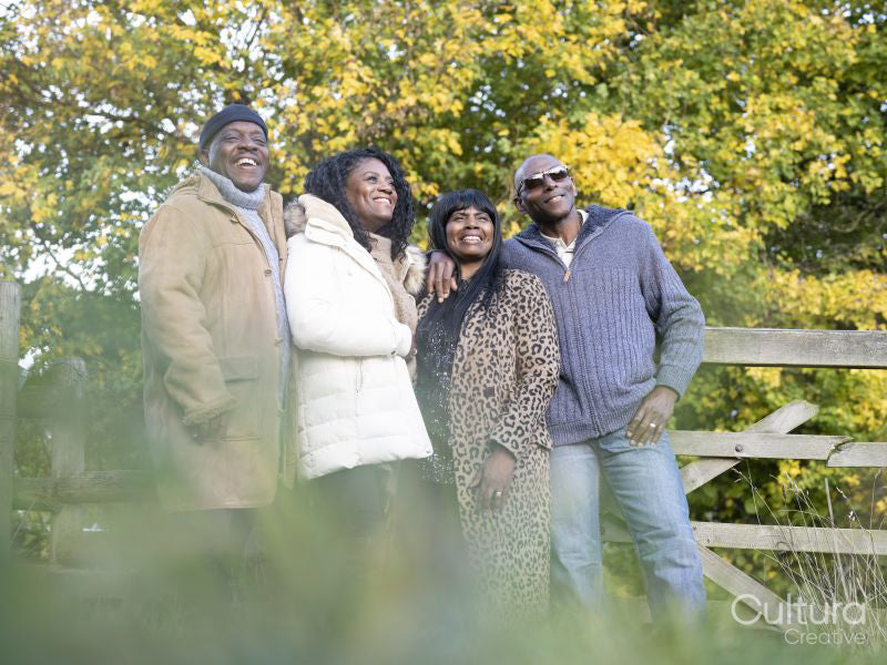 Portrait of two senior couples standing in nature