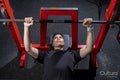 Overhead view of woman having bench press training in gym