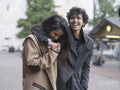 Female couple walking in street