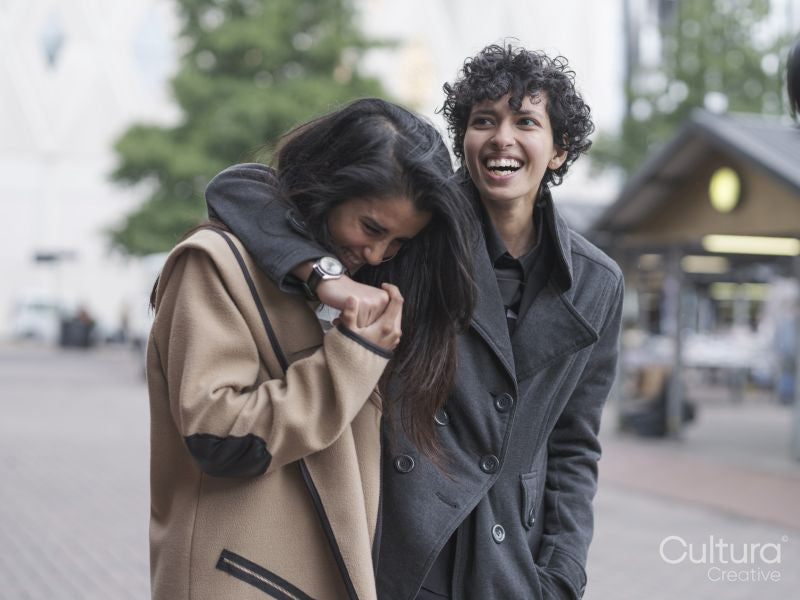 Female couple walking in street