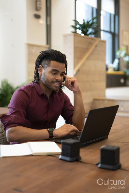 Businessman working on laptop in office