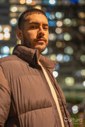 Portrait of young man standing outdoors at night