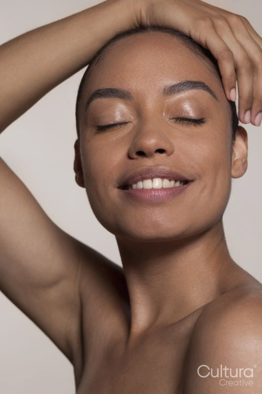 Smiling woman with closed eyes