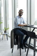 Businessman with laptop working in modern office