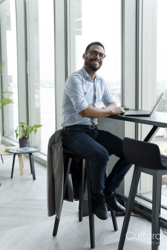 Businessman with laptop working in modern office