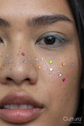 Portrait of woman with colorful shiny freckles