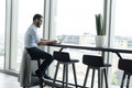 Businessman with laptop working in modern office